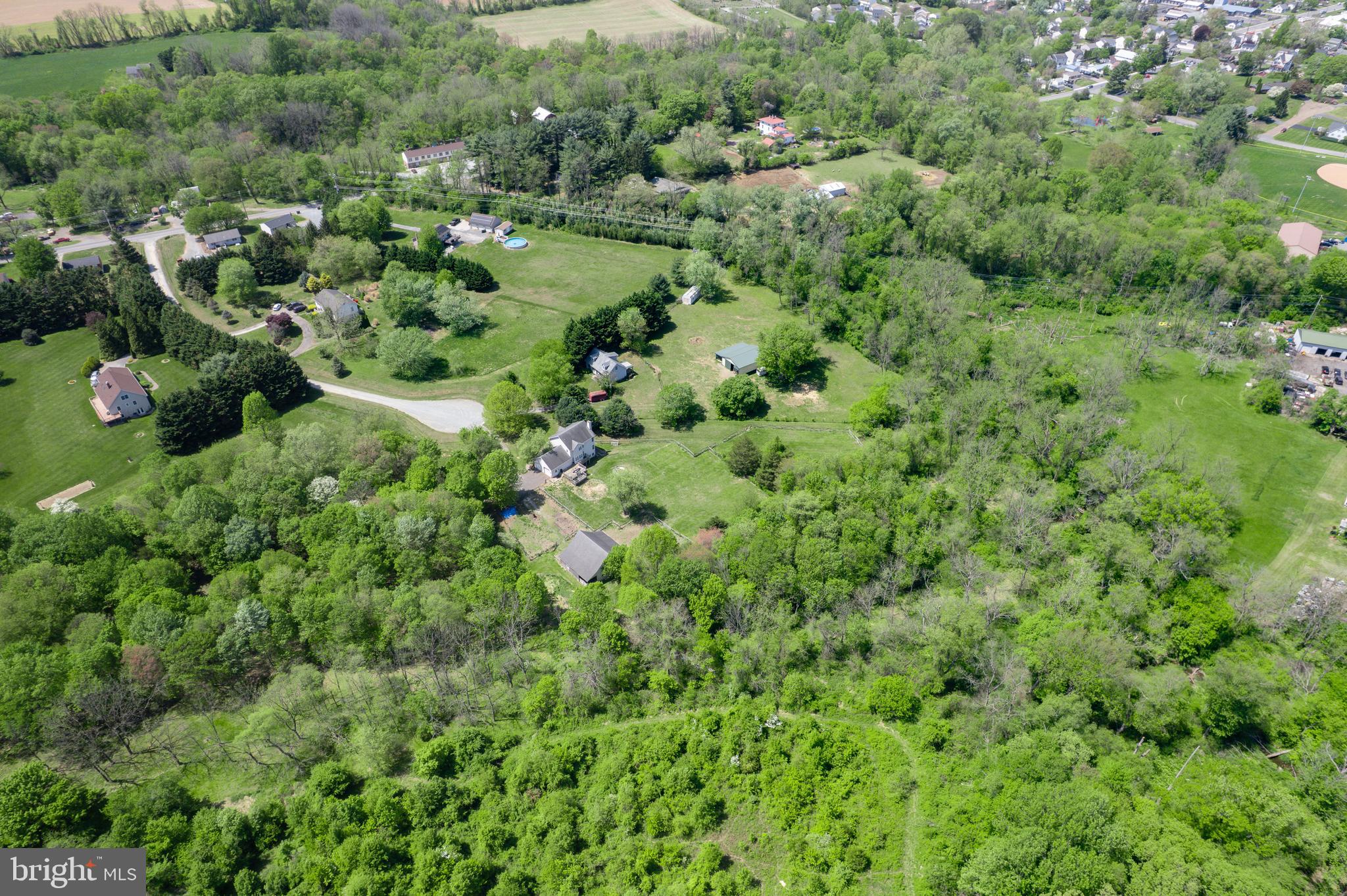 40 Stubb Road Rising Sun, MD 21911 - Photo 33 of 39 an aerial view of a house with a lush green forest