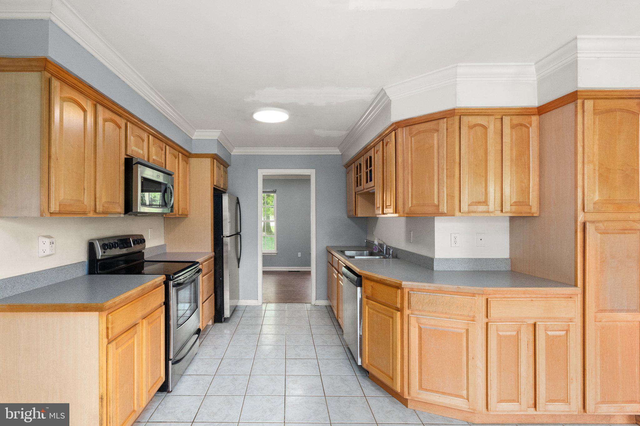 40 Stubb Road Rising Sun, MD 21911 - Photo 7 of 39 a kitchen with stainless steel appliances granite countertop a stove a sink and a microwave
