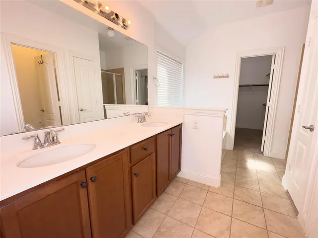 a bathroom with a sink a mirror and a toilet