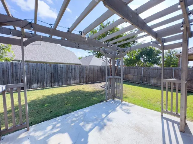 a view of a backyard with a small pool