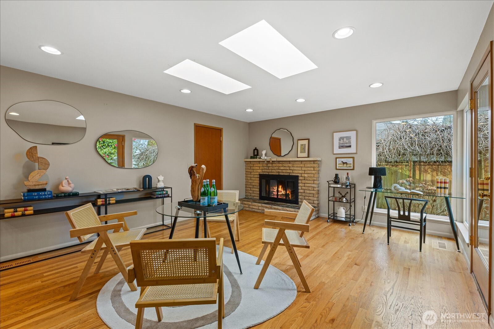 6520 Northeast 60th Street Seattle, WA 98115 - Photo 11 of 40 a living room with furniture and a fireplace