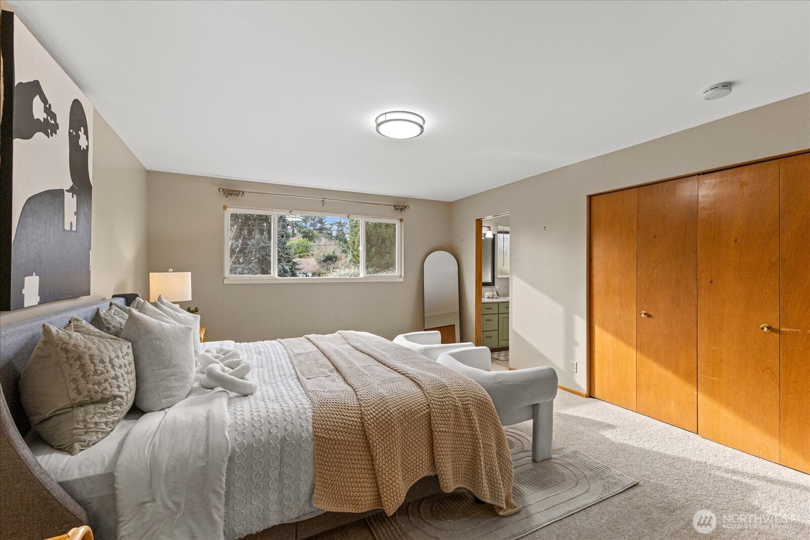 6520 Northeast 60th Street Seattle, WA 98115 - Photo 19 of 40 a bedroom with a bed and a window