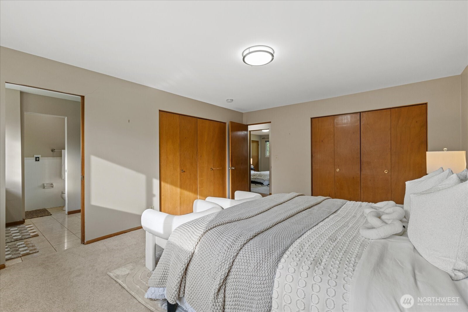 6520 Northeast 60th Street Seattle, WA 98115 - Photo 20 of 40 a bedroom with a bed and a mirror