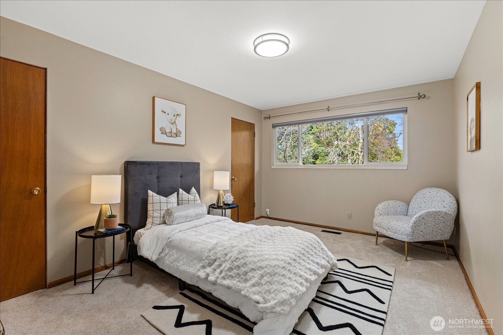 6520 Northeast 60th Street Seattle, WA 98115 - Photo 23 of 40 a bedroom with a bed and a window