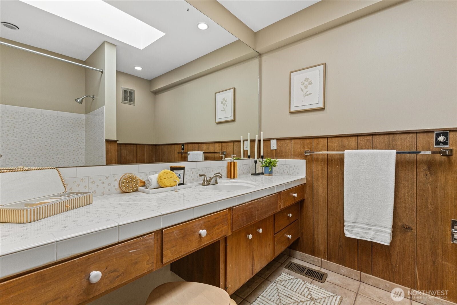 6520 Northeast 60th Street Seattle, WA 98115 - Photo 24 of 40 a bathroom with a granite countertop sink and a mirror