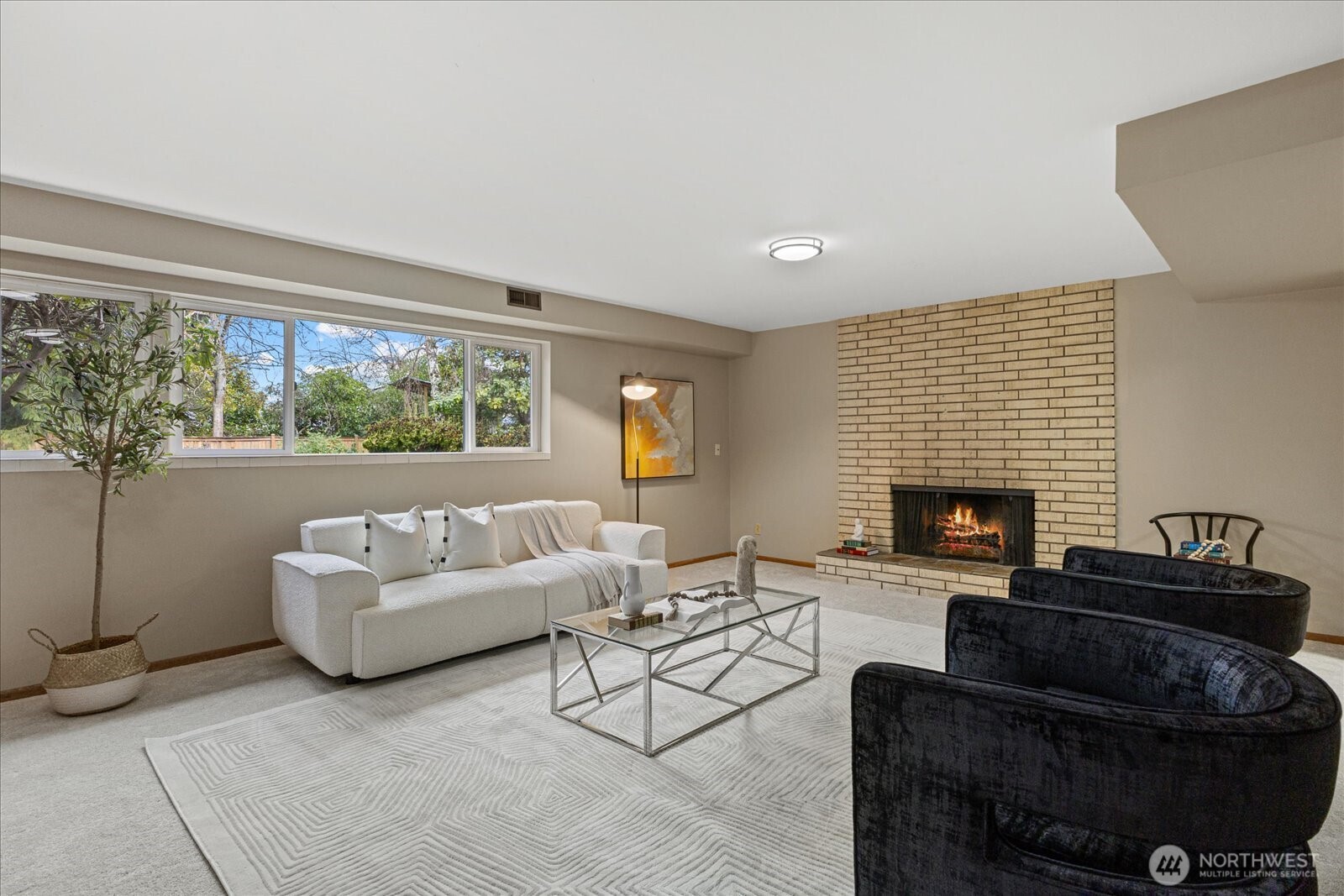 6520 Northeast 60th Street Seattle, WA 98115 - Photo 26 of 40 a living room with furniture and a fireplace