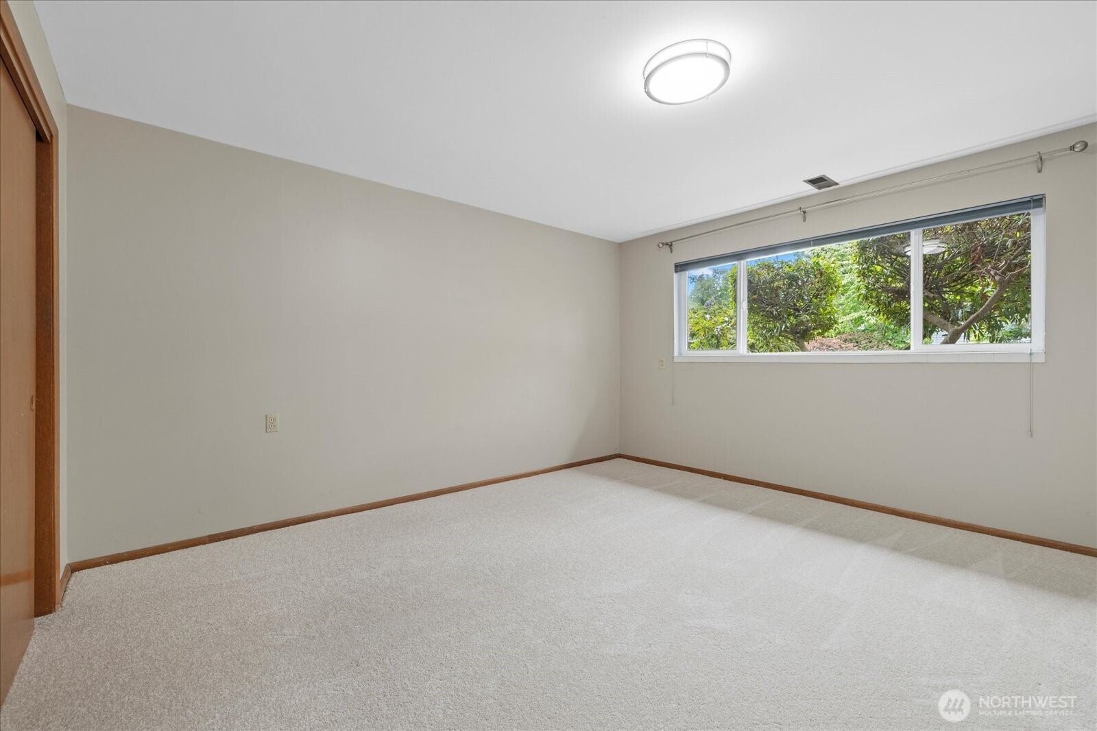6520 Northeast 60th Street Seattle, WA 98115 - Photo 32 of 40 an empty room with windows