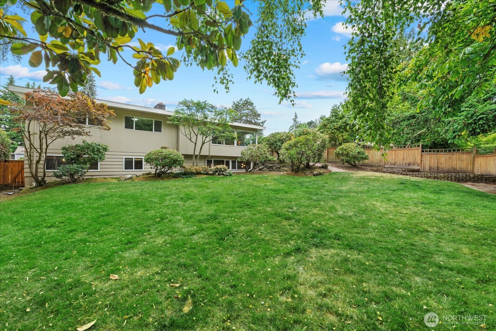 6520 Northeast 60th Street Seattle, WA 98115 - Photo 37 of 40 a view of a house with a yard porch and sitting area