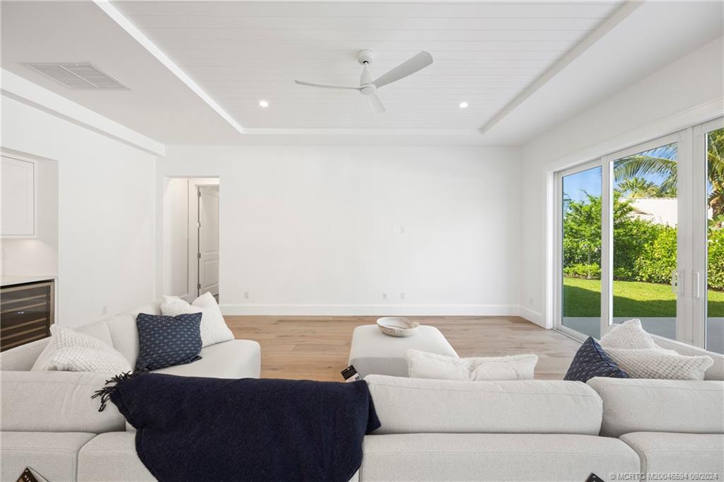 180 Beacon Lane Jupiter, FL 33469 - Photo 13 of 63 a living room with furniture and a large window