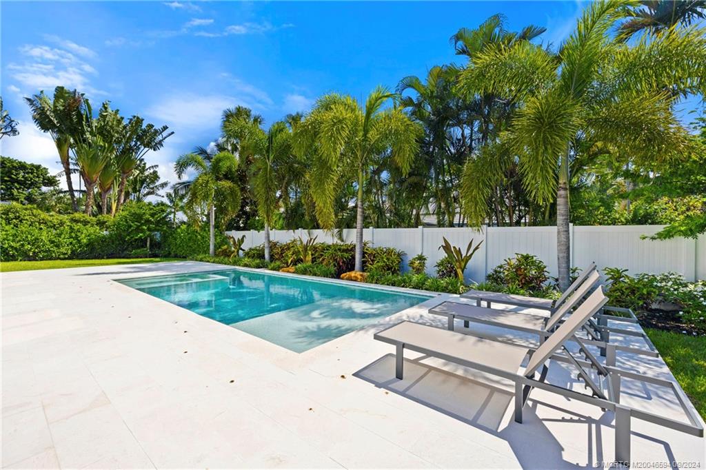 180 Beacon Lane Jupiter, FL 33469 - Photo 6 of 63 a garden view with a seating space