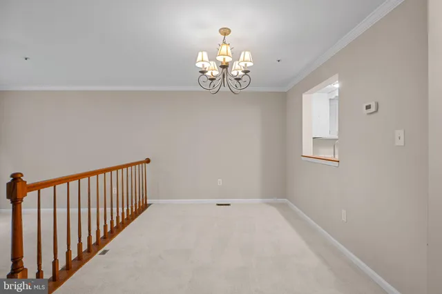 a view of kitchen with chandelier