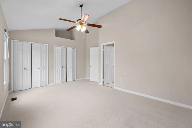 a bathroom with a double vanity sink toilet mirror and bathtub