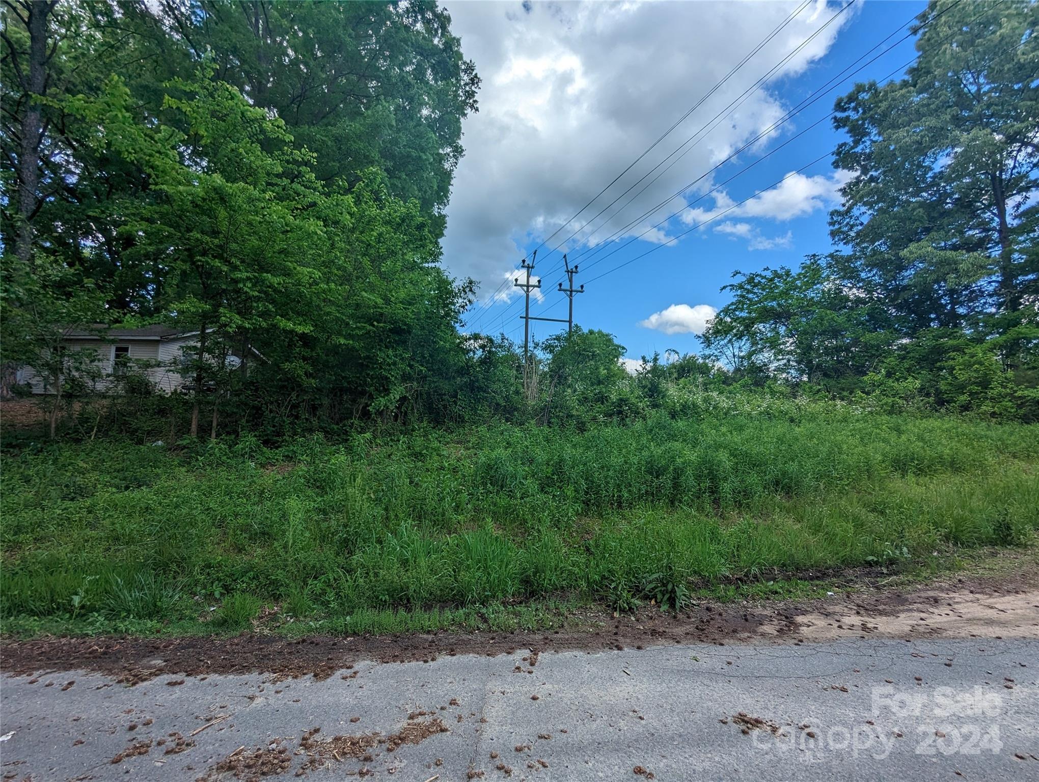 229 Boger Court Southwest Concord, NC 28025 - Photo 4 of 6 a view of a dry yard with a house in the background