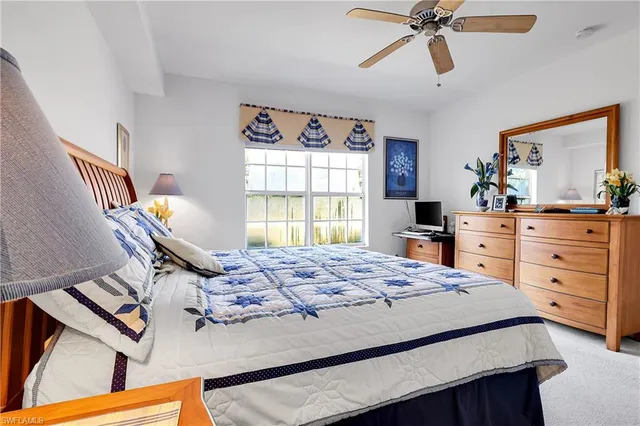 a bed room with a bed and a window