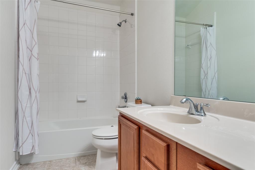 2025 Testament Trail Plano, TX 75074 - Photo 16 of 29 a bathroom with a sink a toilet and shower