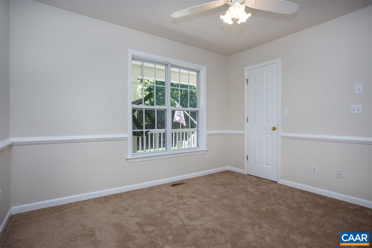 391 Rudolph Street Ruckersville, VA 22968 - Photo 16 of 31 an empty room with chandelier fan and windows