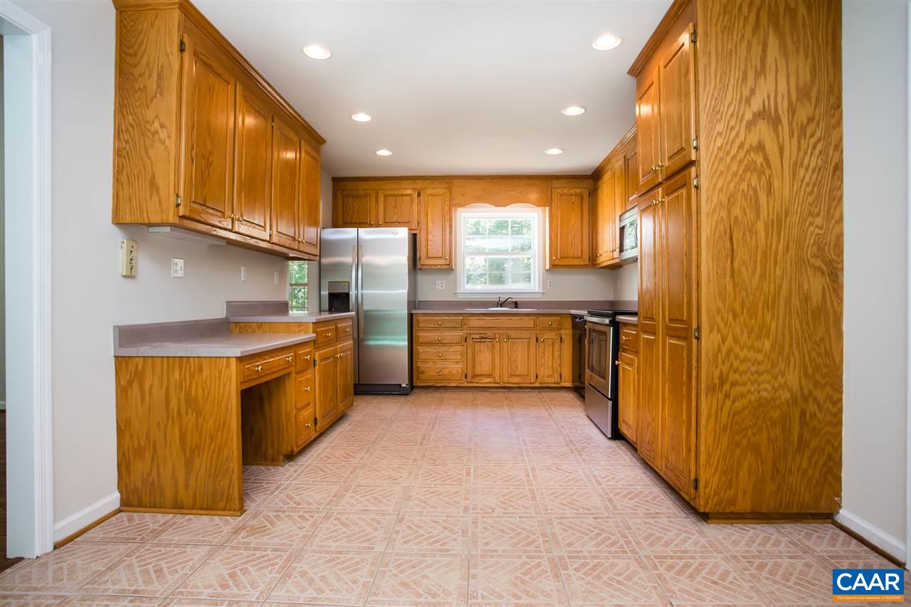 391 Rudolph Street Ruckersville, VA 22968 - Photo 2 of 31 a kitchen with stainless steel appliances granite countertop a stove a sink and a refrigerator