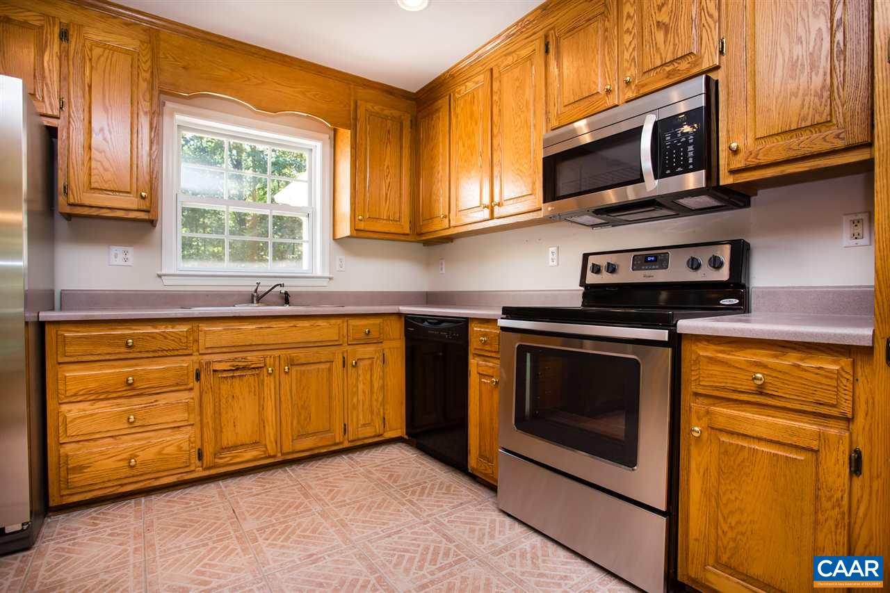 391 Rudolph Street Ruckersville, VA 22968 - Photo 3 of 31 a kitchen with stainless steel appliances granite countertop a stove microwave and sink