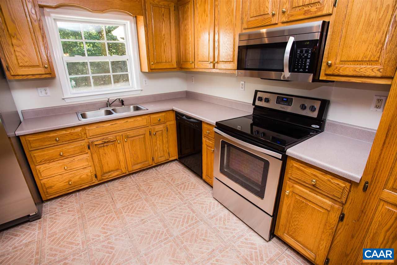 391 Rudolph Street Ruckersville, VA 22968 - Photo 4 of 31 a kitchen with stainless steel appliances granite countertop stove top oven a sink dishwasher and granite countertops