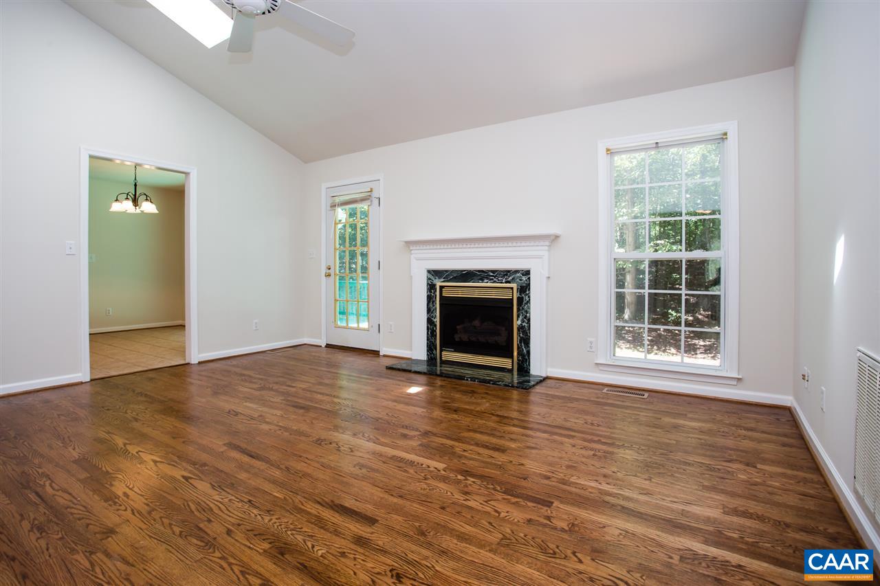 391 Rudolph Street Ruckersville, VA 22968 - Photo 7 of 31 a view of empty room with wooden floor and fireplace