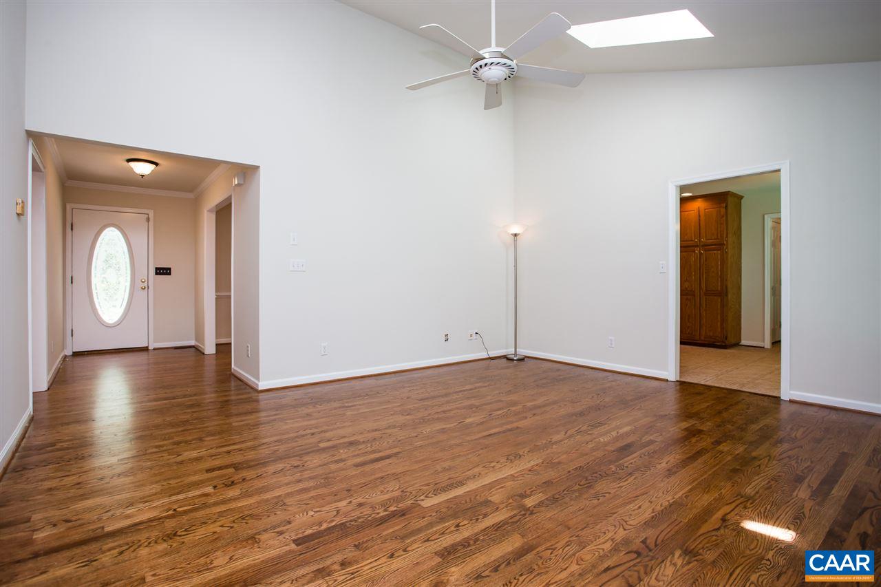 391 Rudolph Street Ruckersville, VA 22968 - Photo 8 of 31 a view of an empty room with wooden floor and fan