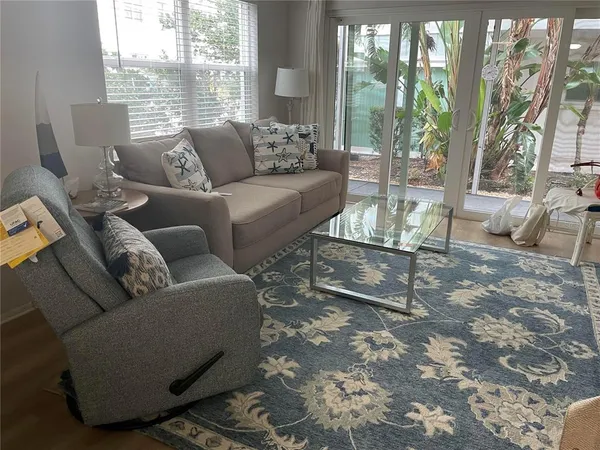 a living room with furniture and a large window
