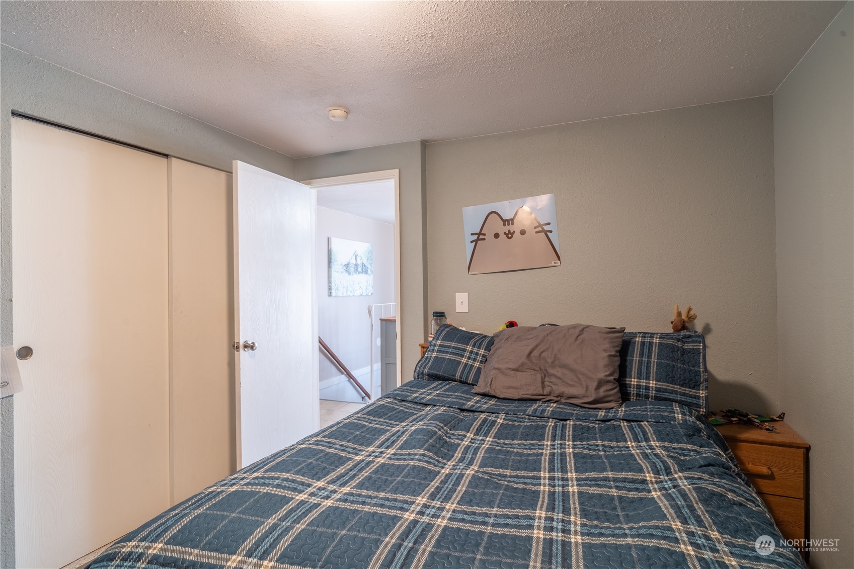 102 East Herman Road Lind, WA 99341 - Photo 18 of 40 a bedroom with a bed and wooden floor