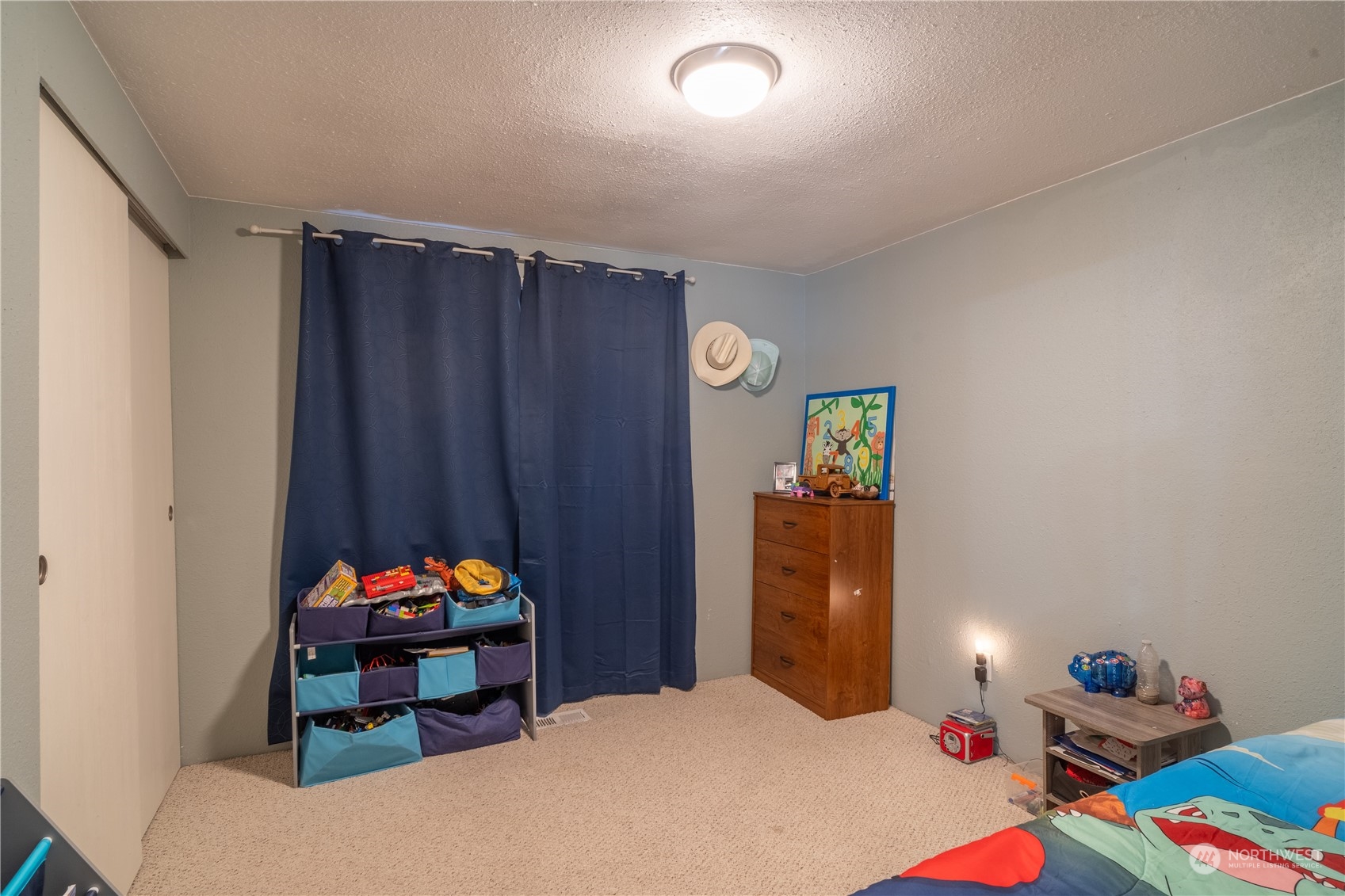 102 East Herman Road Lind, WA 99341 - Photo 20 of 40 a bedroom with filled bed and a window