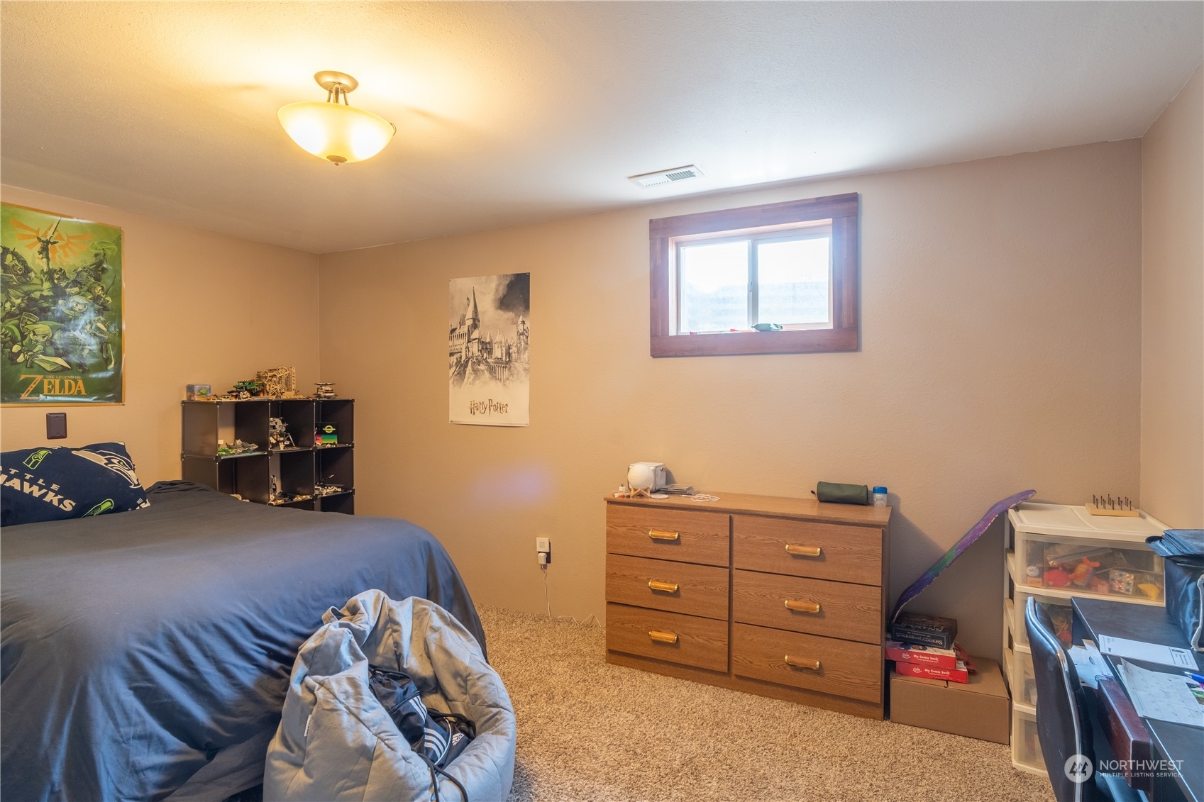 102 East Herman Road Lind, WA 99341 - Photo 34 of 40 a bed room with a bed and a couch