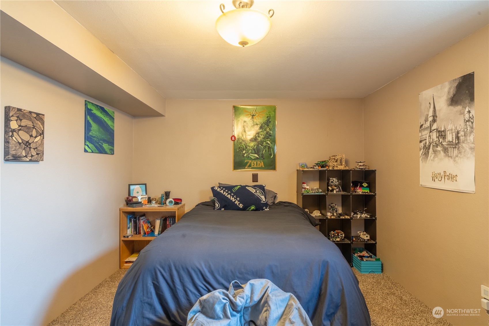 102 East Herman Road Lind, WA 99341 - Photo 35 of 40 a bedroom with a bed and a book shelf