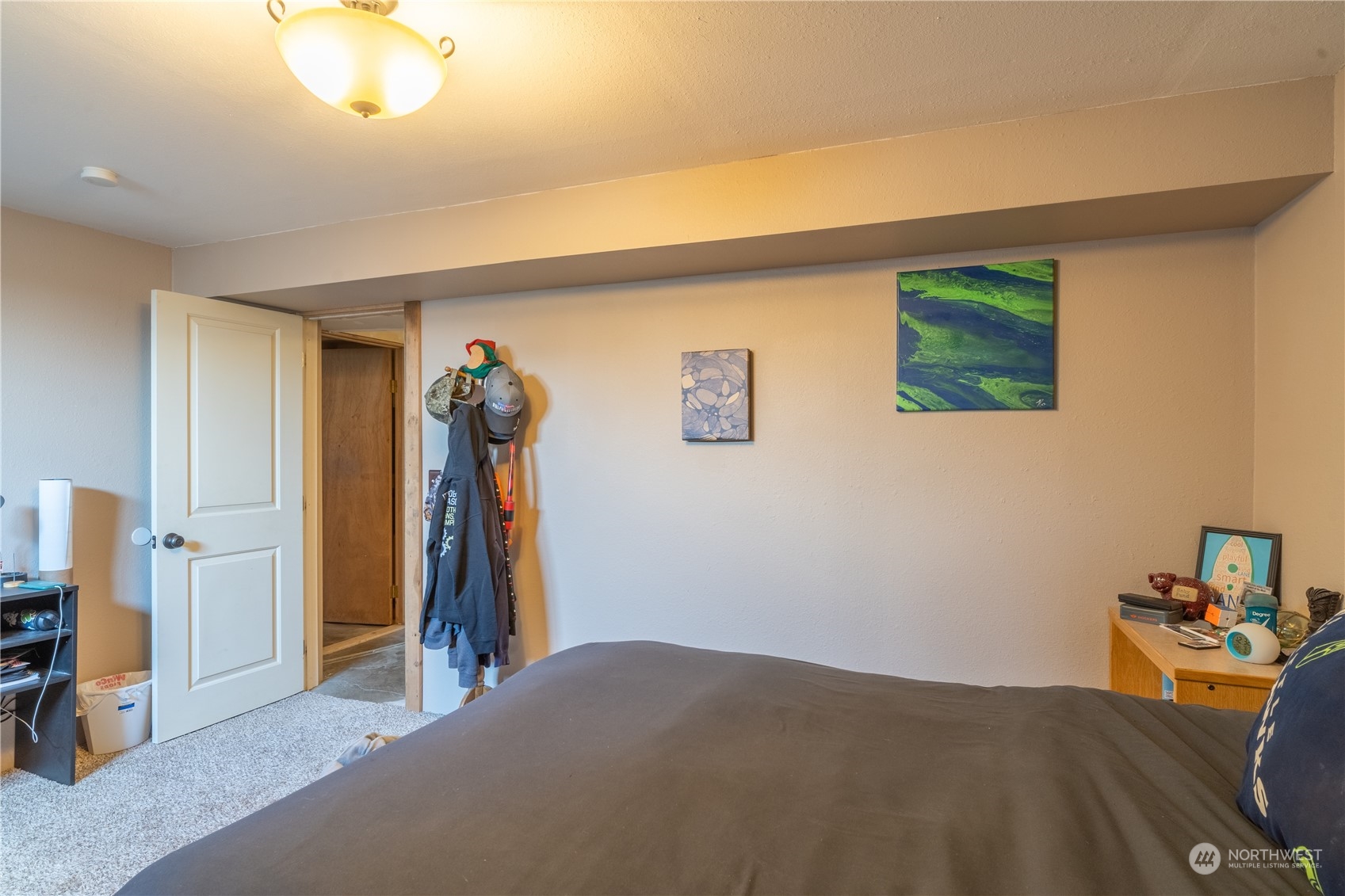 102 East Herman Road Lind, WA 99341 - Photo 36 of 40 a bedroom with a bed and a chandelier