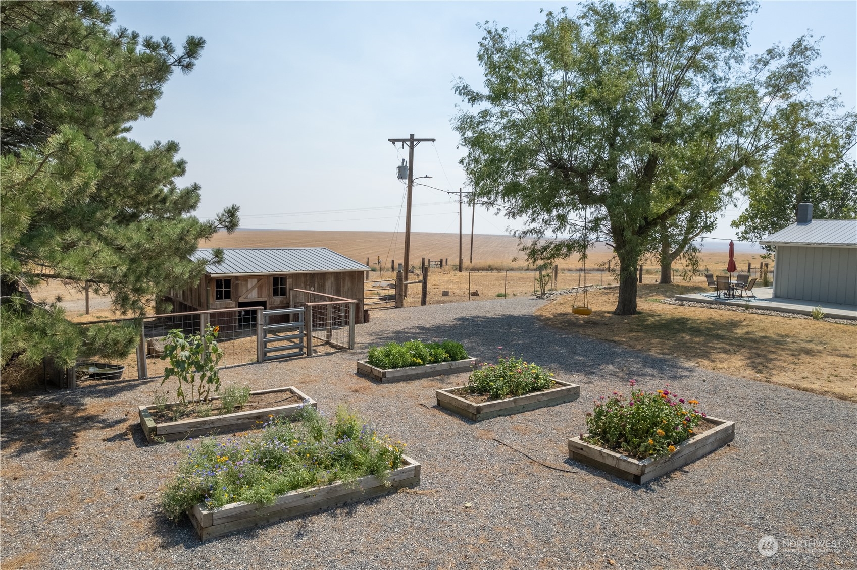 102 East Herman Road Lind, WA 99341 - Photo 5 of 40 a view of a backyard with sitting area