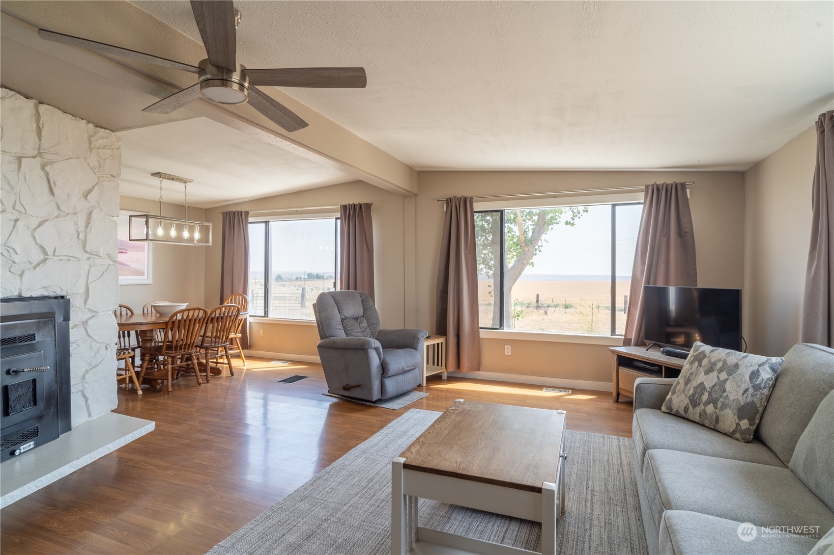102 East Herman Road Lind, WA 99341 - Photo 8 of 40 a living room with furniture and a large window