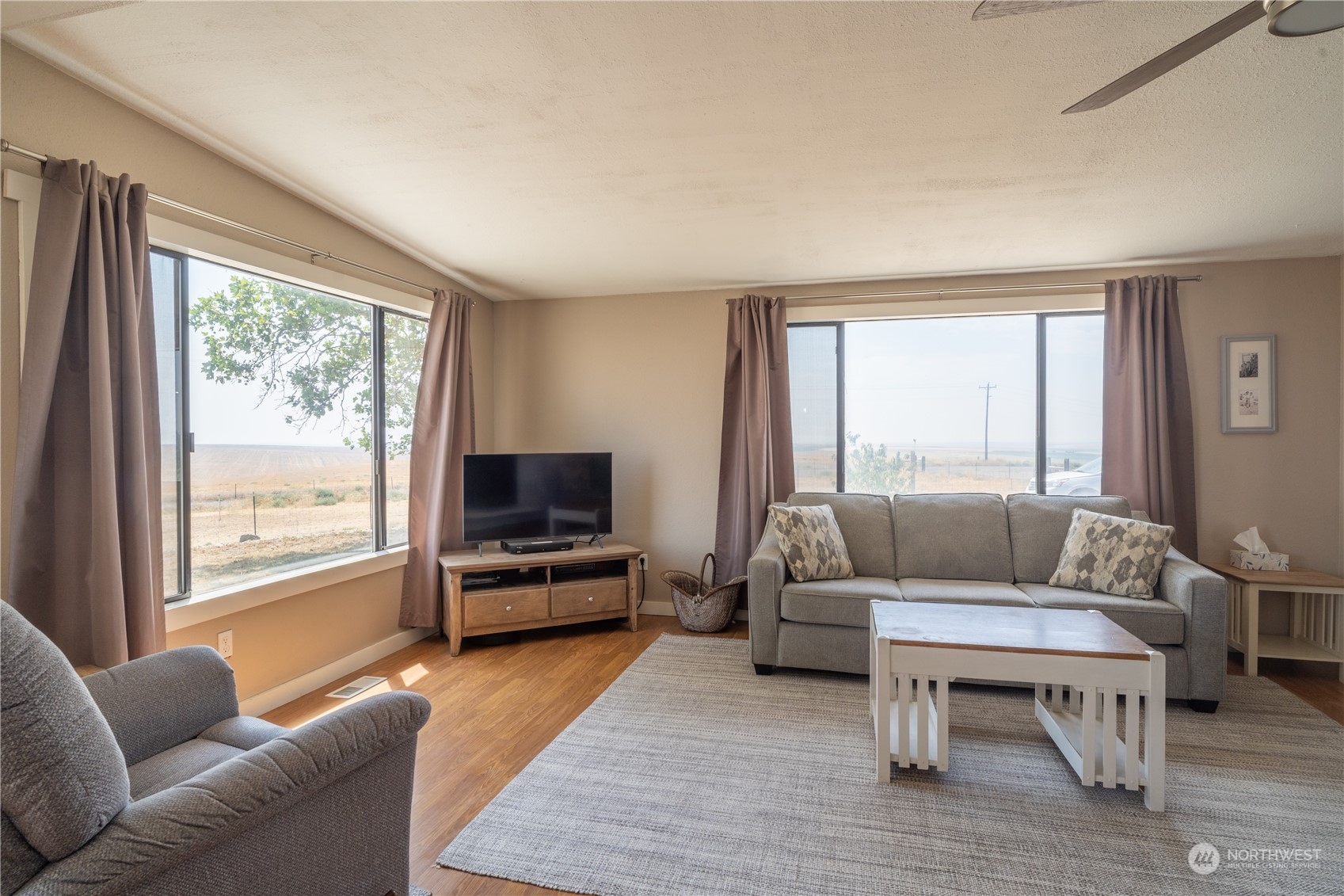 102 East Herman Road Lind, WA 99341 - Photo 9 of 40 a living room with furniture and a flat screen tv