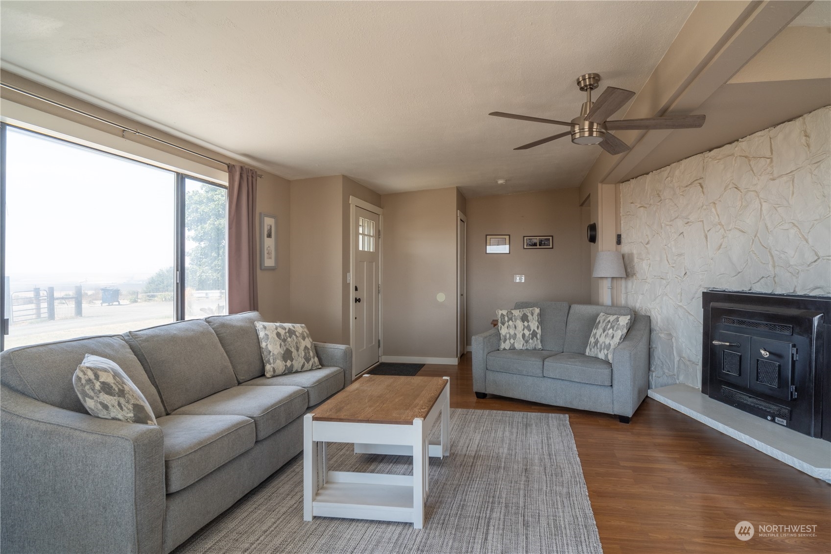 102 East Herman Road Lind, WA 99341 - Photo 10 of 40 a living room with furniture and a fireplace