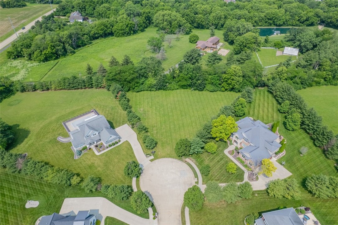 1935 Buckhead Court Decatur, IL 62521 - Photo 1 of 5 an aerial view of a house with a garden and lake view