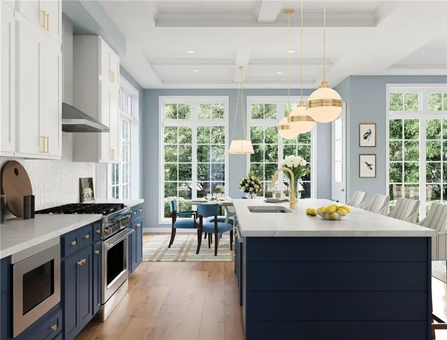 a kitchen with a stove a sink and a dining table with wooden floor