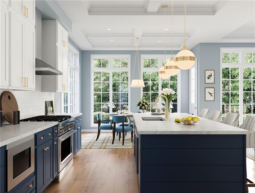 102 Ramsgate Road, Unit LUDLOW Cranberry Township, PA 16066 - Photo 6 of 38 a kitchen with a stove a sink and a dining table with wooden floor
