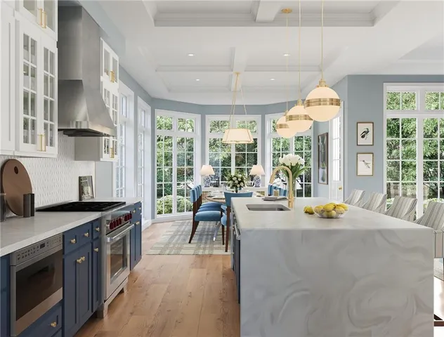 a kitchen with a stove a refrigerator a sink dishwasher dining table and chairs with wooden floor