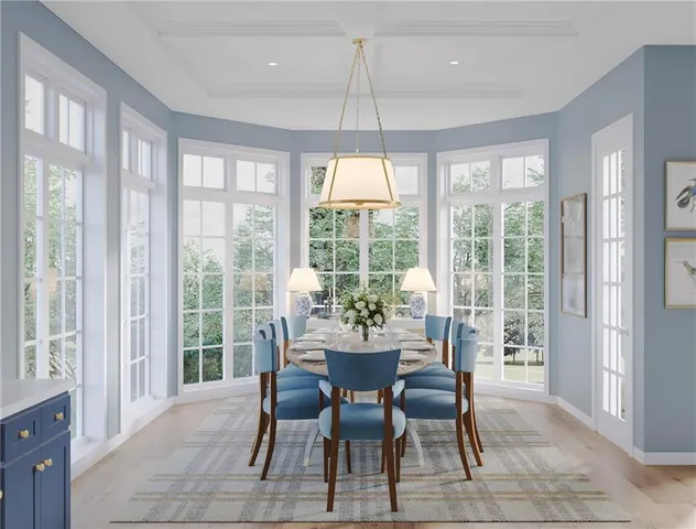 a dining room with furniture a chandelier and wooden floor