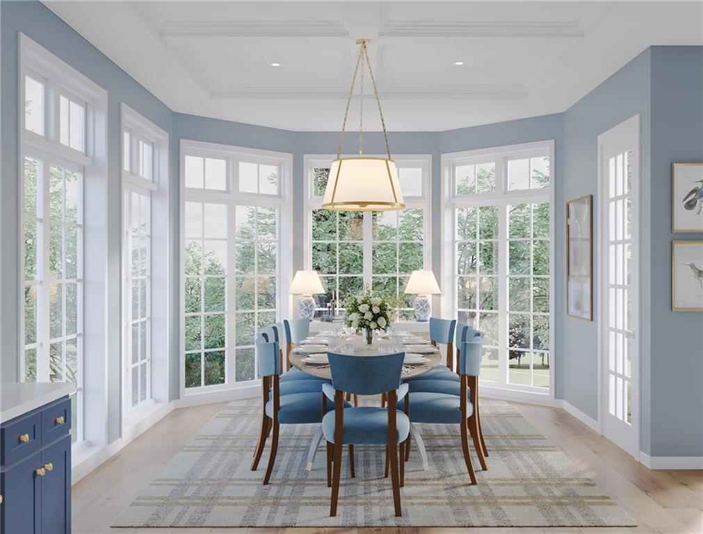 102 Ramsgate Road, Unit LUDLOW Cranberry Township, PA 16066 - Photo 8 of 38 a dining room with furniture a chandelier and wooden floor