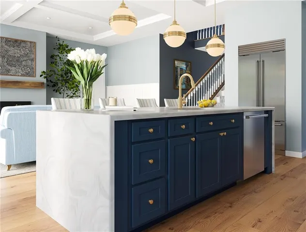 a kitchen with a sink and a refrigerator