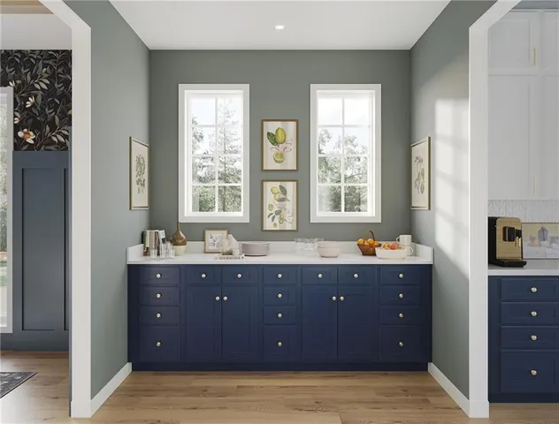 a spacious bathroom with double vanity and a bathtub