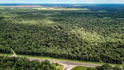 a view of a field with an outdoor space