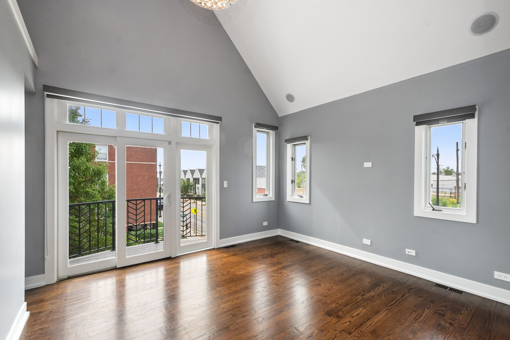 3700 North Kenneth Avenue Chicago, IL 60641 - Photo 13 of 29 a view of an empty room with wooden floor and a window