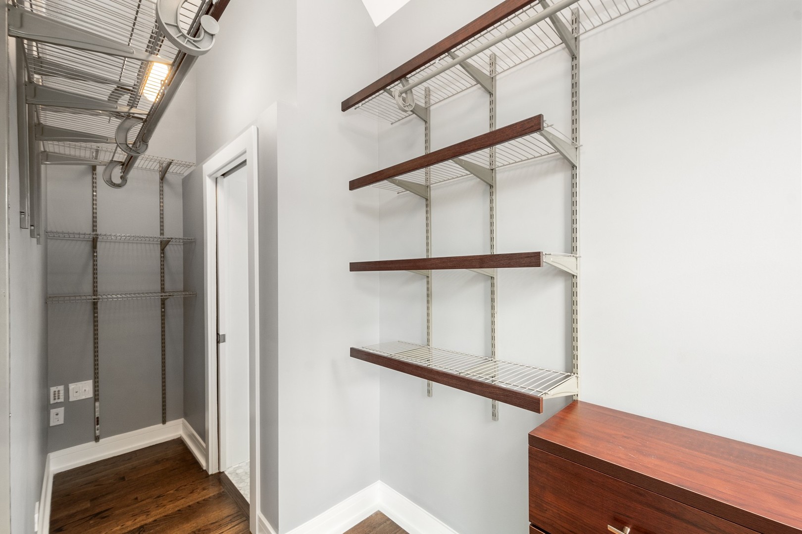 3700 North Kenneth Avenue Chicago, IL 60641 - Photo 15 of 29 a view of staircase with wooden floor and small bathroom