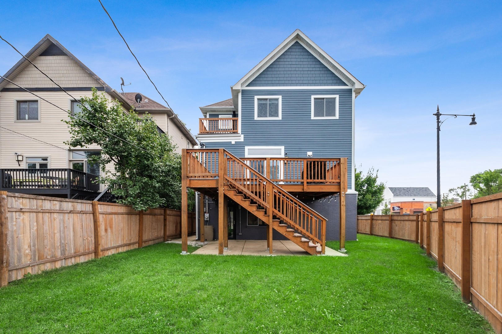 3700 North Kenneth Avenue Chicago, IL 60641 - Photo 22 of 29 a view of a house with a yard and deck