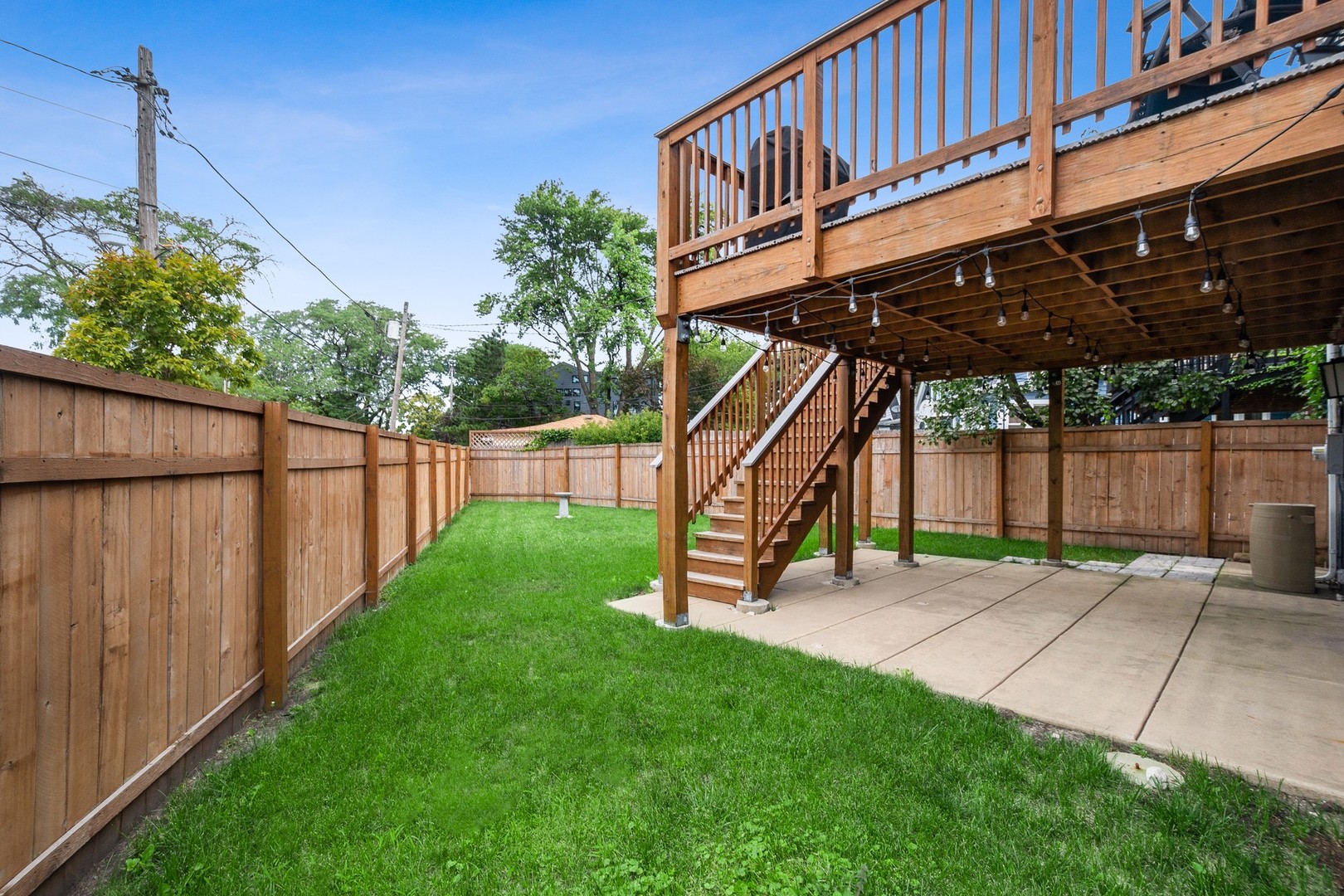 3700 North Kenneth Avenue Chicago, IL 60641 - Photo 24 of 29 a view of a backyard with a deck and a garden