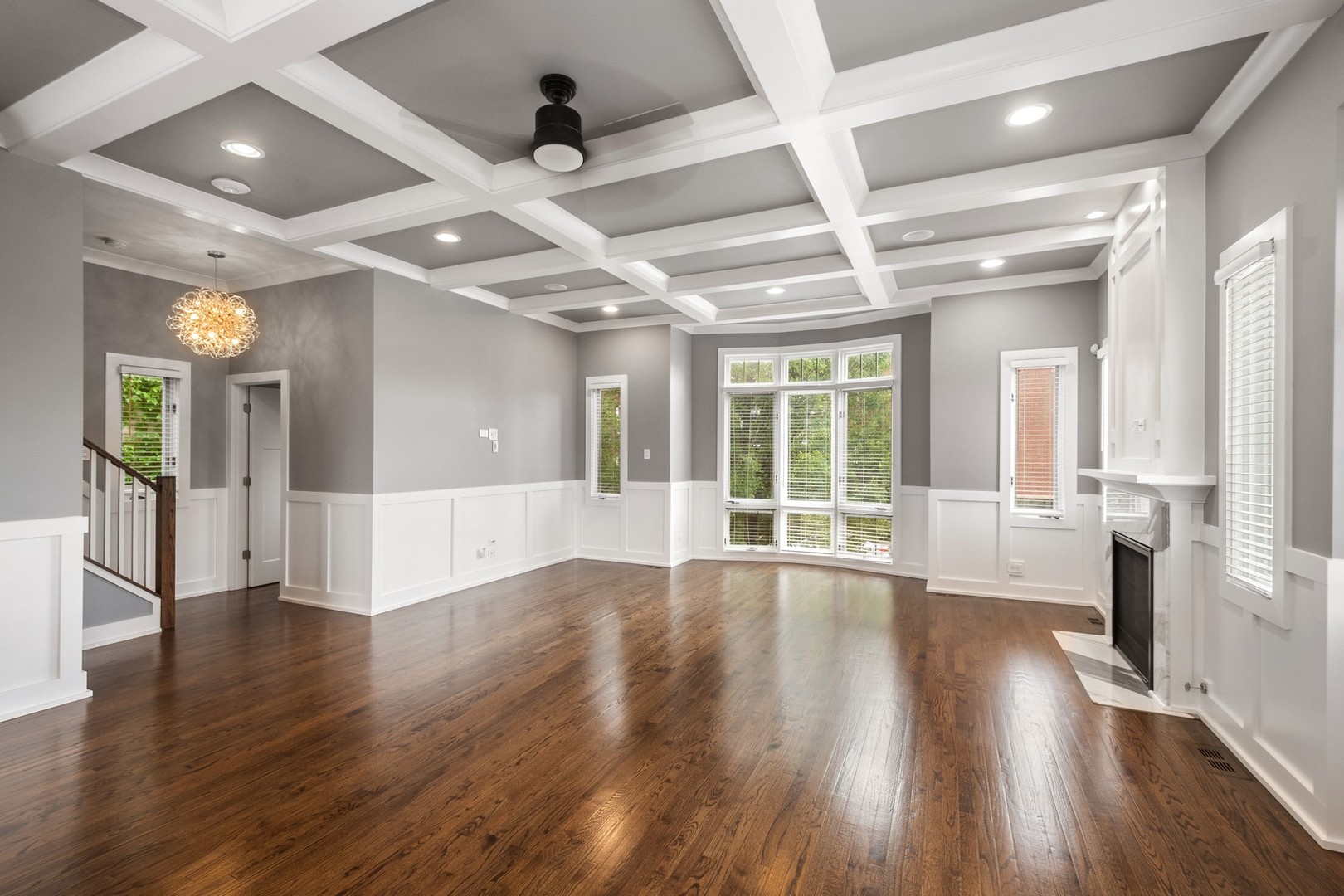 3700 North Kenneth Avenue Chicago, IL 60641 - Photo 4 of 29 a view of an empty room with wooden floor and a large window