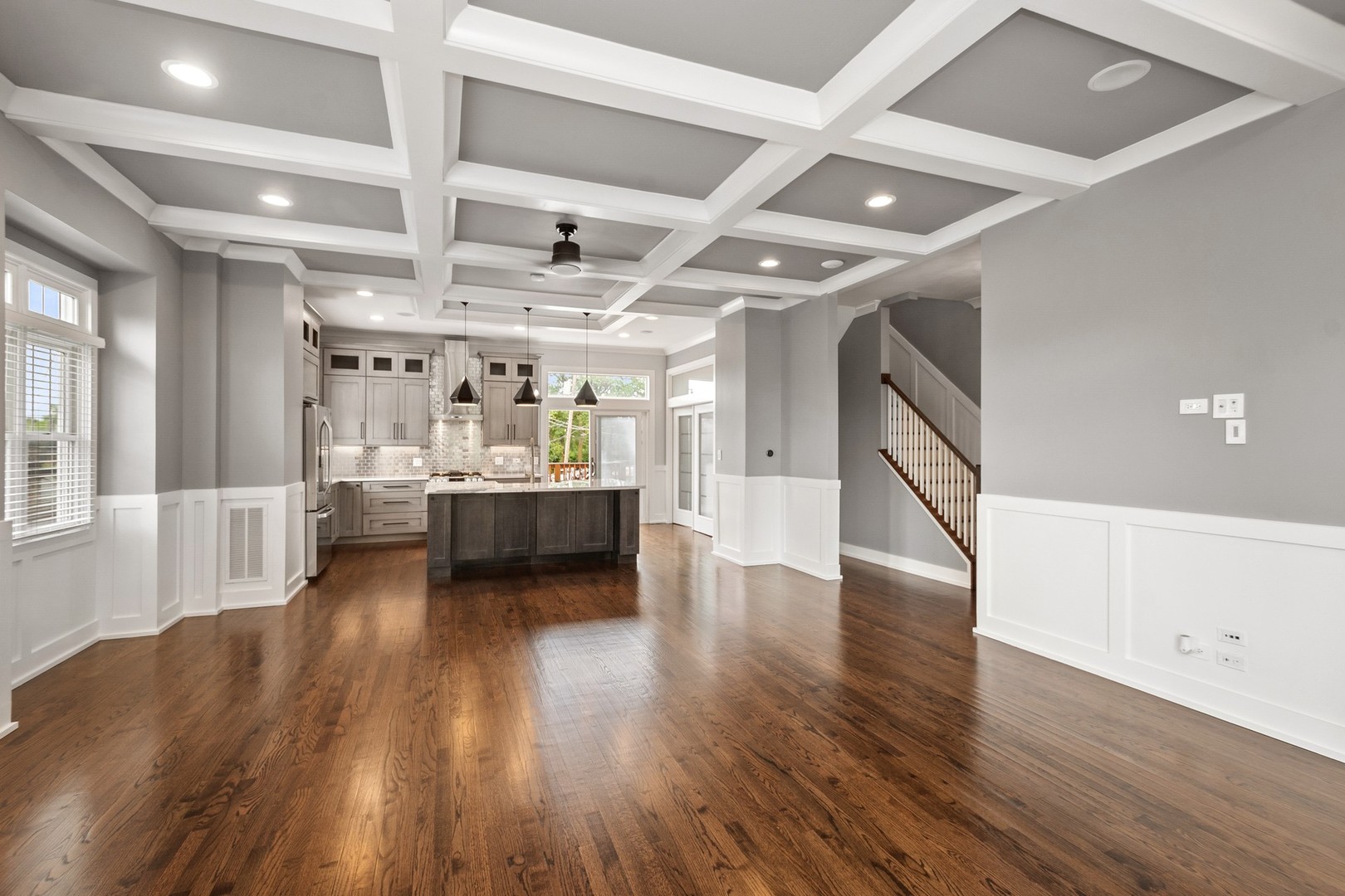 3700 North Kenneth Avenue Chicago, IL 60641 - Photo 5 of 29 a view of a big room with wooden floors and windows